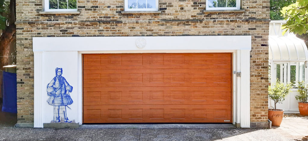 Hormann Georgian Sectional Garage door in Golden Oak Decograin