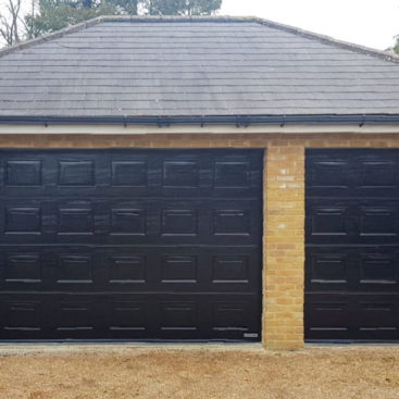 Hormann LPU42 Sectional Doors in Black Woodgrain