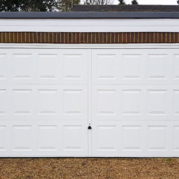 Garador Georgian Double Retractable Garage Door finished in “Traffic White”