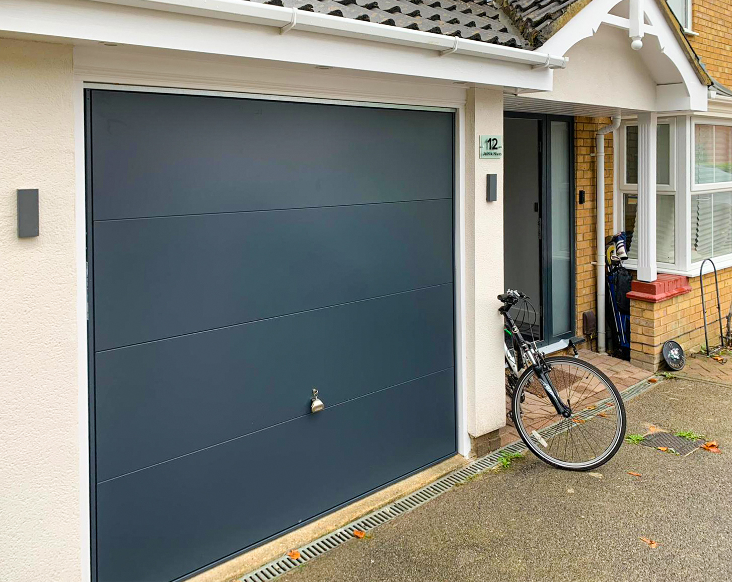 Garador Design 100 Wide Ribbed Steel Canopy Up & Over Garage Door Finished in Anthracite Grey