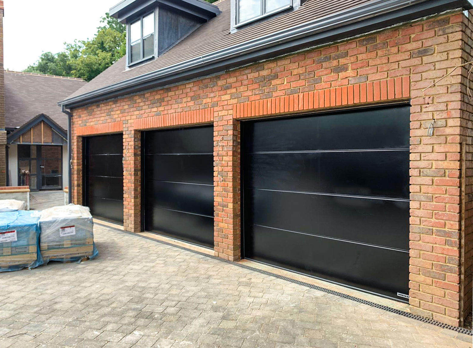 3x Hormann LPU42 L-Ribbed Insulated Sectional Garage Doors finished in Black